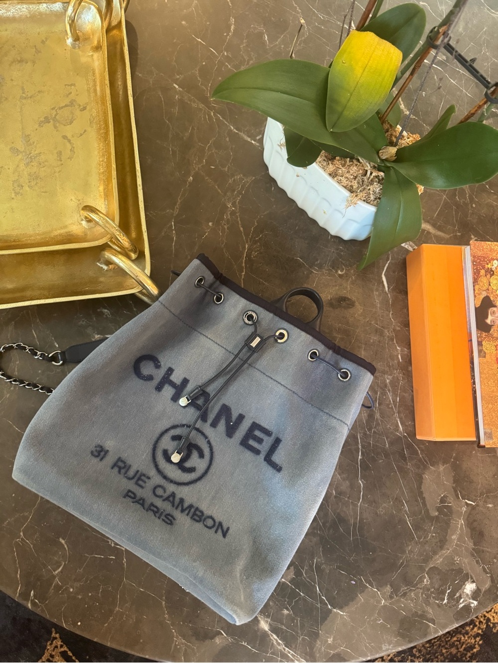 CHANEL Gray-Blue Drawstring Backpack with Black Trim